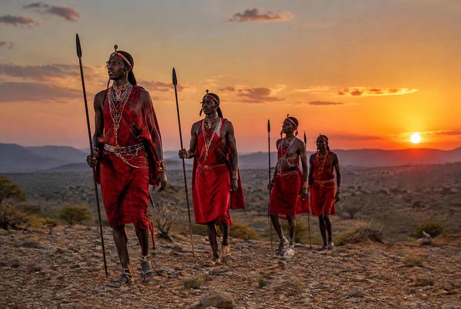 Samburu men walking at sunset